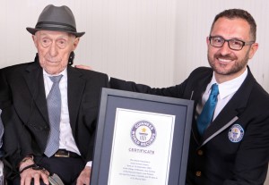Above: In this photo supplied by Guinness World Records, Marco Frigatti, Head of Records for Guinness World Records, right, presents Israel Kristal a certificate for being the oldest living man, in Haifa, Israel, Friday, March 11, 2016.